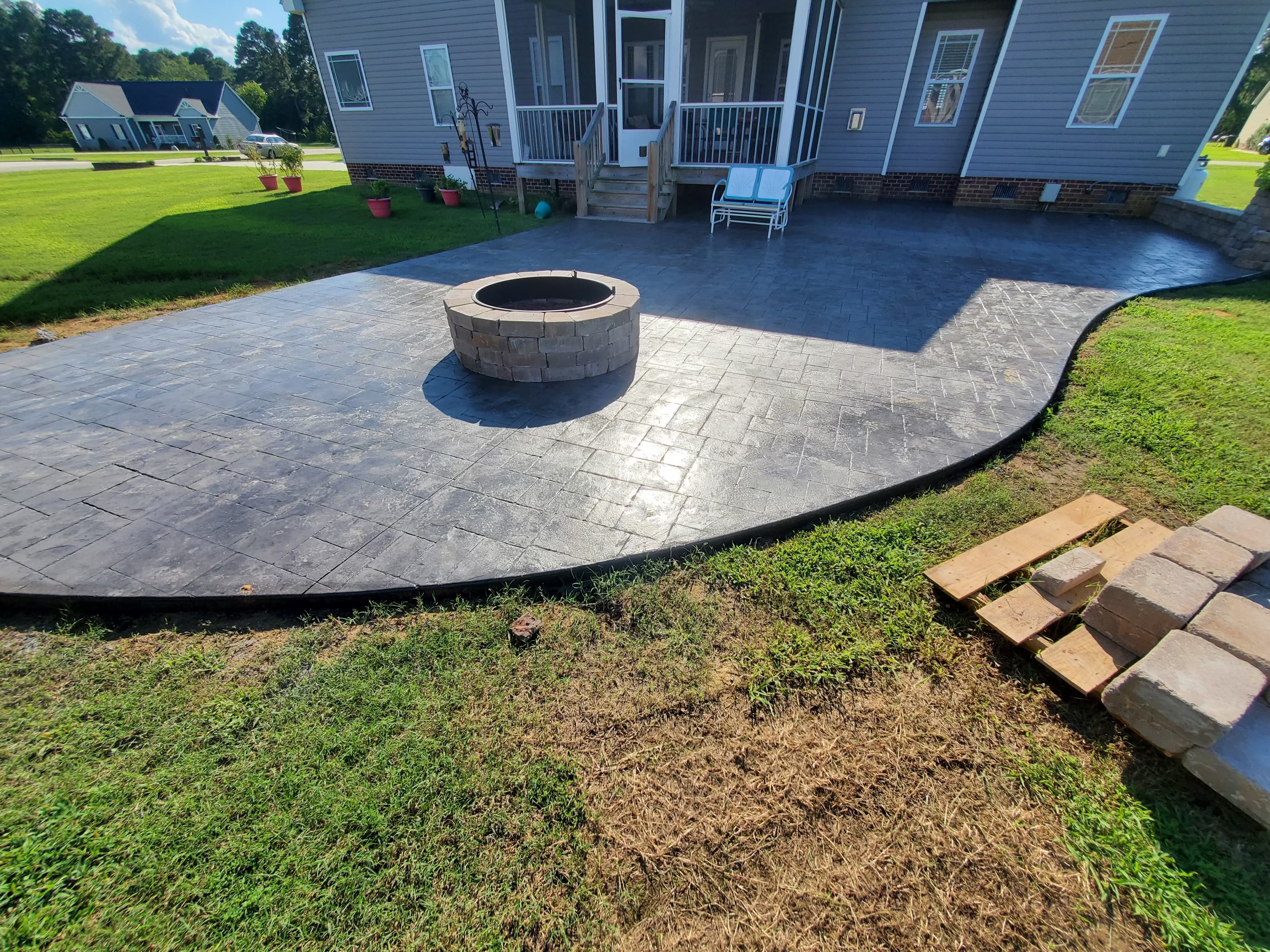 stamped concrete patio and custom fire pit by pacheco custom masonry and concrete in north carolina